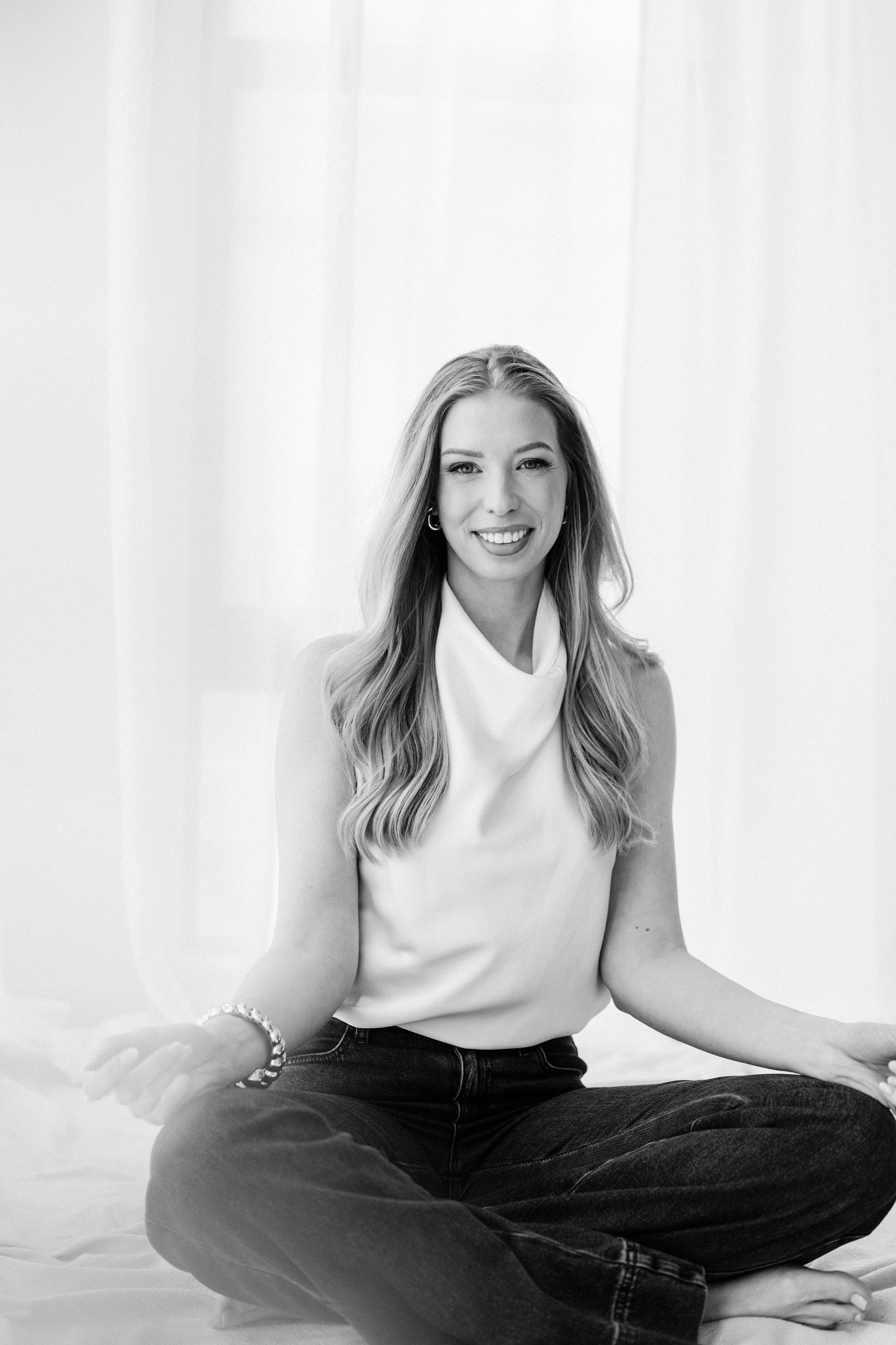 Portrait — black and white seated on floor